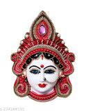 Red plastic Maa Lakshmi face god idol for prosperity and worship, approximately 15x13x4 cm