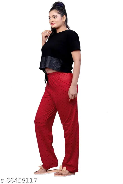 Red pants with a black top, big dotted print, lounge wear for women