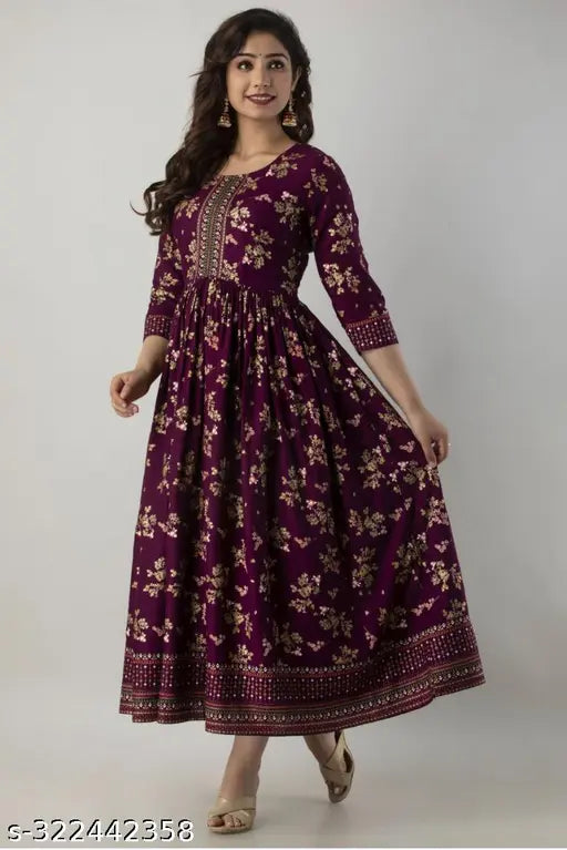 Wine-colored rayon Anarkali border print kurti with tassels, three-quarter sleeves and flared silhouette - ideal for everyday ethnic wear