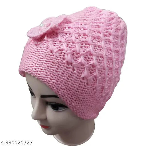Pink knit cap with a bow on top