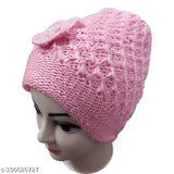 Pink knit cap with a bow on top