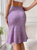 A woman wearing a mid-thigh pencil print skirt