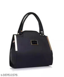 Black leather handbag with metallic accents