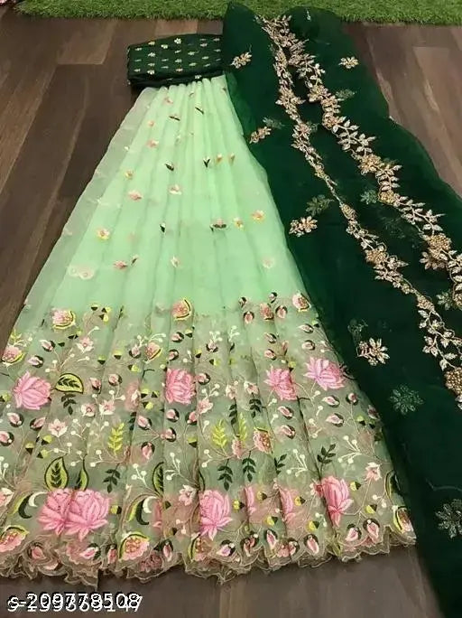 Heavy net embroidered lehenga choli, dupion silk topwear with multi thread work, net bottomwear and dupatta with intricate cut work border and embroidery, free size, Indian bridal wear on display