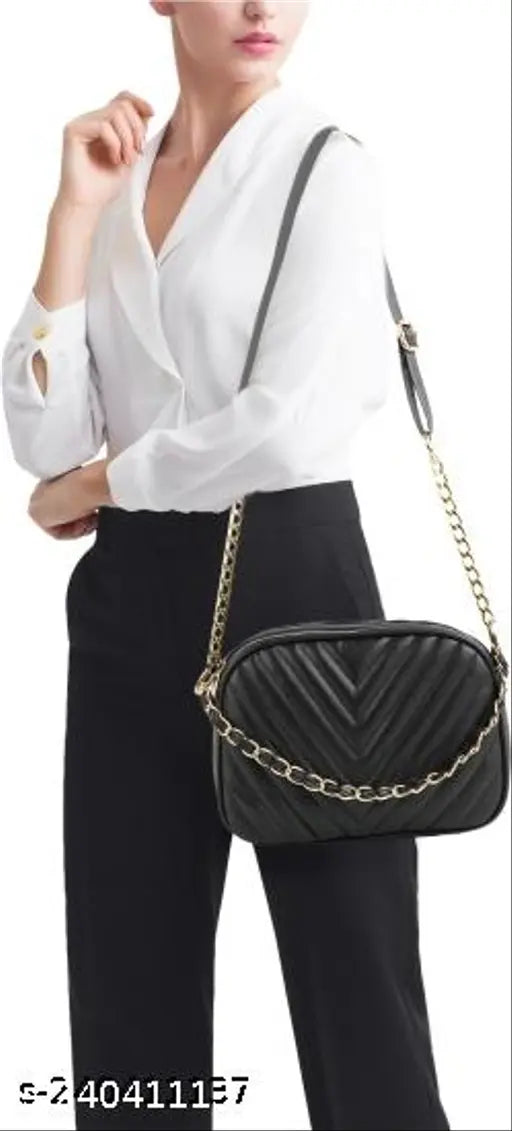 Black leather sling bag, gold chain strap