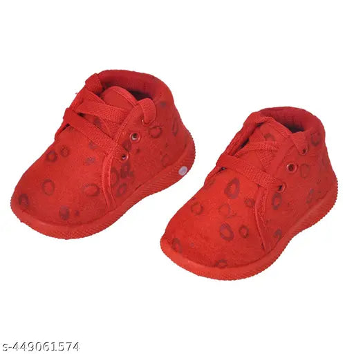 Red crocodile skin baby shoes, featuring two pairs with red accents