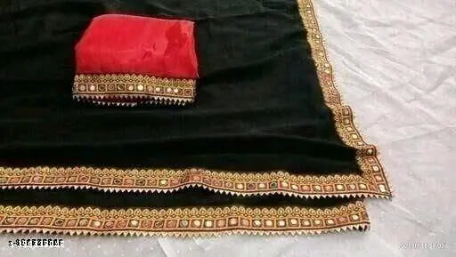 Maharani black saree with intricate designs and a vibrant red pallu