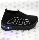 Black and white sneakers with blue LED lights on soles