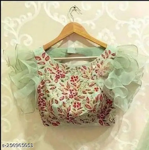 Light green semi-stitched net lehenga choli with lace work, embellished blouse and ruffled dupatta on mannequin for parties or functions