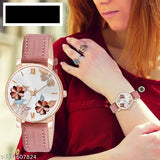 Floral design analog watch with brown leather strap, grey-pink hues