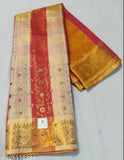 Gold and red silk sari with intricate pallu design, Kundan style detailing