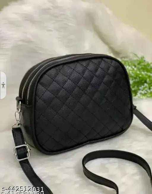 Womens stylish sling bag with black leather finish and adjustable strap