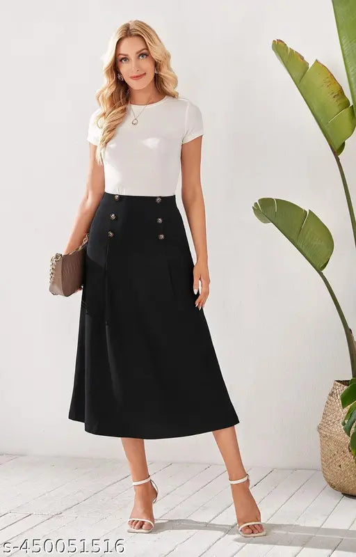 Woman standing against white wall, wearing black pencil skirt with slit side, black heels, and carrying purse