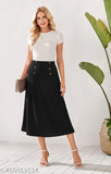 Woman standing against white wall, wearing black pencil skirt with slit side, black heels, and carrying purse