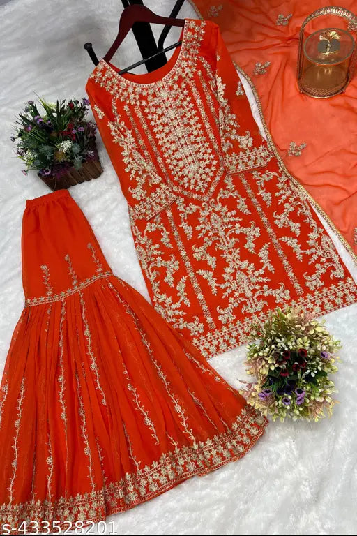 Red and gold embroidered three-piece bridal attire with sharara, dupatta