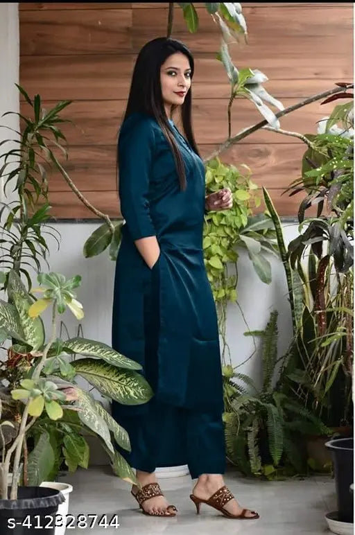 Teal viscose rayon kurta pant set for women and girls, suitable for parties, weddings, office wear. Solid-patterned, three-quarter sleeves, palazzos style. High-quality, comfortable, and fashionable Indian clothing