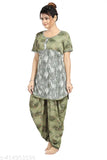 Green polyester dhoti top night suit with printed net pattern, featuring round neck and short sleeves. Includes matching dhoti-style bottom with side pocket. Indian origin