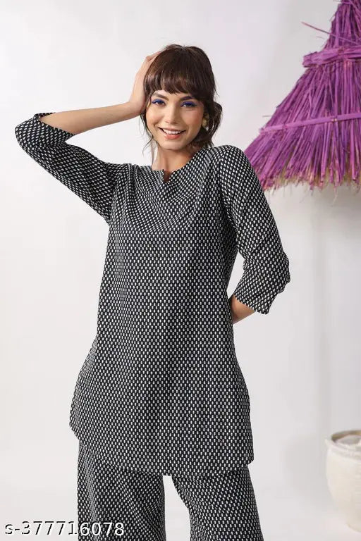 Women's rayon slub printed co-ord set, three-quarter sleeves, hand-printed all over. Rayon slub top and pant with paan neck design for casual, formal, daily, festive, or tour wear. Sizes: S(36), M(38), L(40), XL(42), XXL(44). India origin