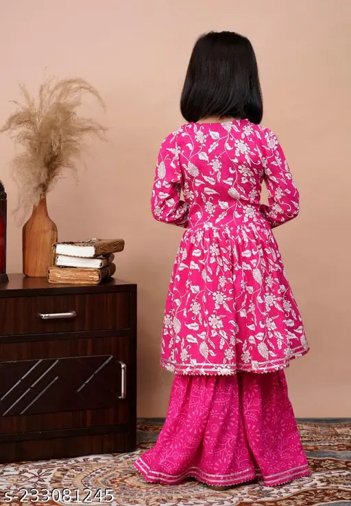 Pink rayon anarkali kurta with sharara and dupatta, embroidered floral pattern. Perfect for festive occasions. Luxurious Indian ethnic wear." (115 characters)