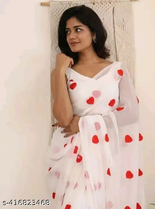Georgette saree with red heart pattern on fabric