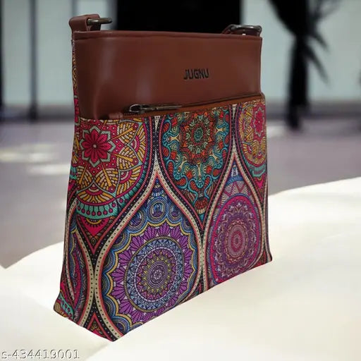 Multicolored handcrafted women's shoulder bag with faux leather, long adjustable belt, and a compact design. Handmade from ecofriendly printed jute fabric