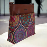 Multicolored handcrafted women's shoulder bag with faux leather, long adjustable belt, and a compact design. Handmade from ecofriendly printed jute fabric