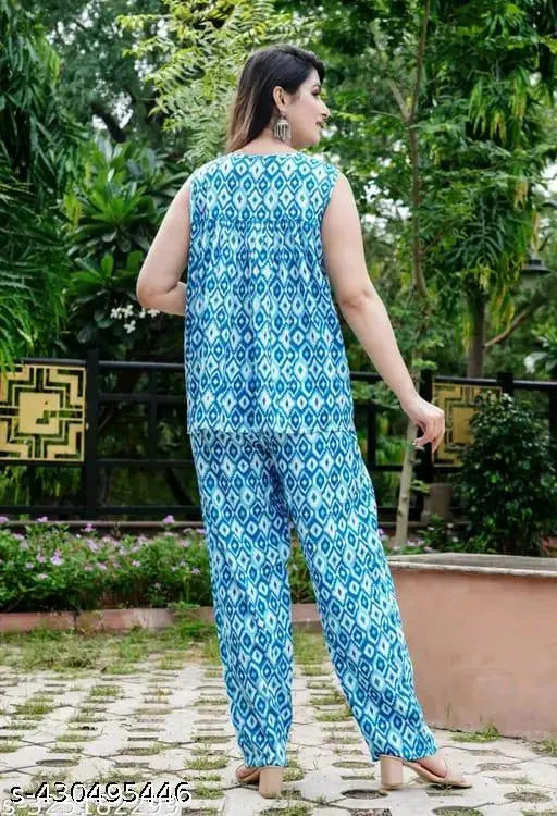 Women's cotton all-over flower printed night suit top & pajama set, sleeveless, vibrant floral pattern on soft cotton fabric