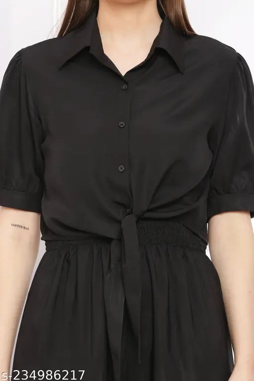 Black color women's solid 2-piece crepe jumpsuits, short sleeves, solid pattern. Jumpsuits shown on model with varying sizes: S (36/52/32), M (38/52/34), L (40/52/36), XL (42/52/38). Made in India