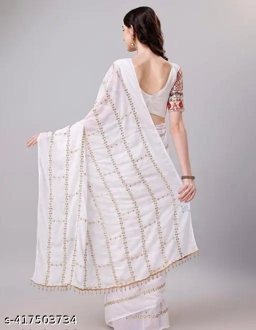 White saree with multiple sequin accents and pallu, patterned border