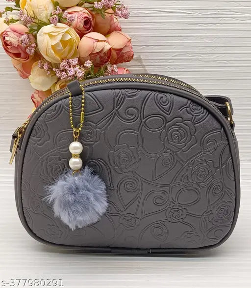 Alluring PU slingbag with self-design pattern, features 4 compartments, free size (L10in x W3in x H8in), India origin