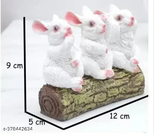 Tree trunk table top figurine with three white and pink rabbit sculptures, as depicted in the given title. 12 cm tall, Feng Shui decorative piece for a living room, office or bedroom
