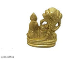 Yellow metal Lord Vishnu with Laxmi resting on Sheshnaag, exquisitely handcrafted Indian idol. Polyresin, golden-painted god sculpture for worship or home decor