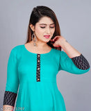 Beyond Fashion Aqua Blue Rayon Kurti, 48" length with 3/4 sleeve, solid printed round pleated flared design. Machine washable, hand wash recommended. Casual and formal wear. Size XS-XXXL included