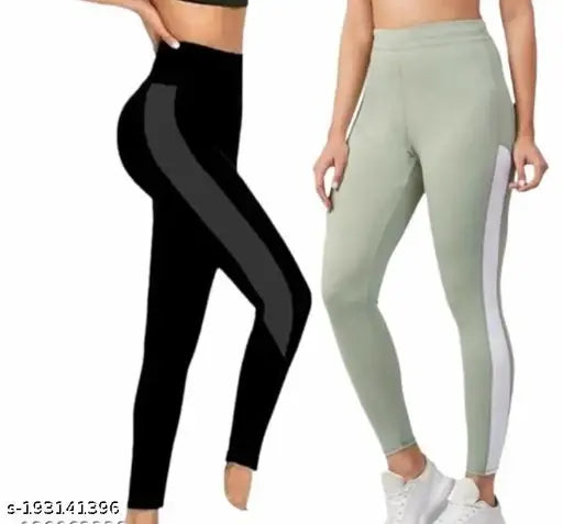 Black and white striped Lycra leggings for women, two-tone design with black upper and dark gray lower half, accented by a hara ma white section. Sizes range from 28 (waist 26in, length 36in) to 42 (waist 30in, length 36in), made in India