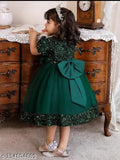Embellished net green wear for kids, showcasing short sleeves in shades of vibrant emerald green