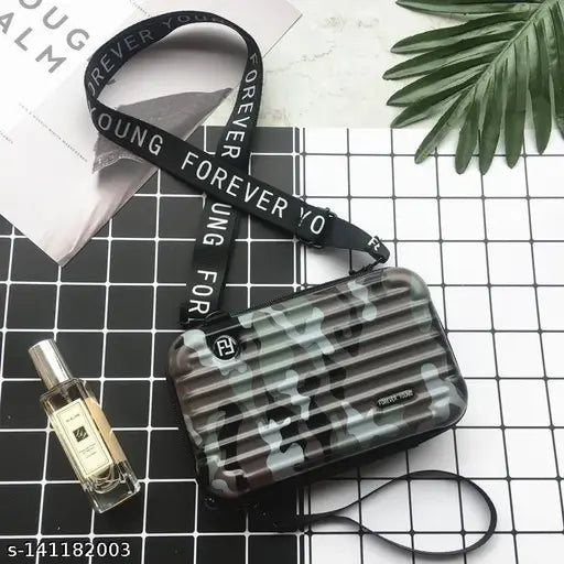 Black, camo print sling bag with multiple pockets and compartments