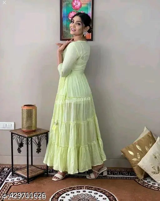 Green lurex cotton embroidery kurta set, three-quarter sleeves, India origin. Light green fashionable gown with tessels and mirror work embroidery. Available in sizes S to 6XL