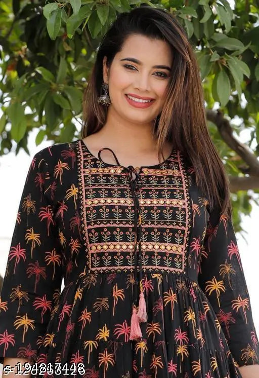 Multi-color rayon long-tiered dress kurti with embroidered yoke and tassels, vibrant printed pattern, three-quarter sleeves