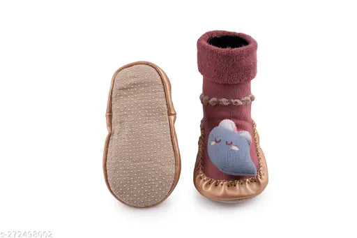 A pair of pink and white soft, breathable children's socks with anti-skid soles. Ideal for newborn to two-year-old kids, providing support for casual wear or unisex fashion