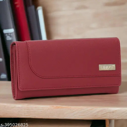 A red, zippered clutch wallet with a visible logo on the front