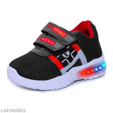 Black and red sports running shoes with LED lights, designed for kids