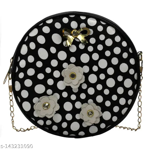 Black and white polka dot crossbody sling bag, featuring floral embellishments and a metal clasp closure