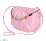 A pink sling bag with a chain shoulder strap