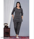 Womens black floral printed cotton kurti set with flared pants, short sleeves, and button-down front