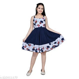 Teen girl in navy blue floral print dress with fitted waist, short sleeves, and A-line skirt, standing against white background
