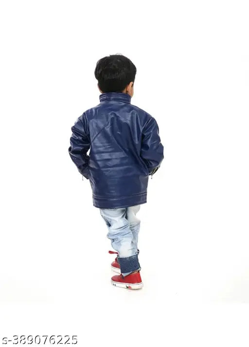 Young boy in a navy jacket, red sneakers