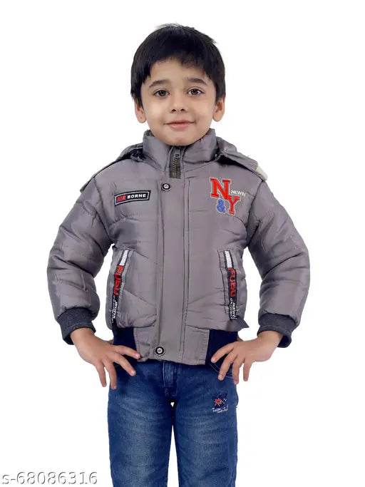 Boy in gray hooded jacket with red name tag