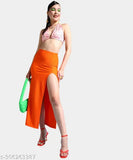 Orange solid A-line polyester skirt, perfect for formal events and parties. High-end fashion, long slit design with crop top option. Available in sizes 26, 28, 30, 32, 34 (waist 26-34, length 39-41in, hip 30-38in). Made in India
