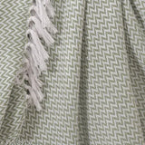 Green chevron patterned cotton throw with fringe details