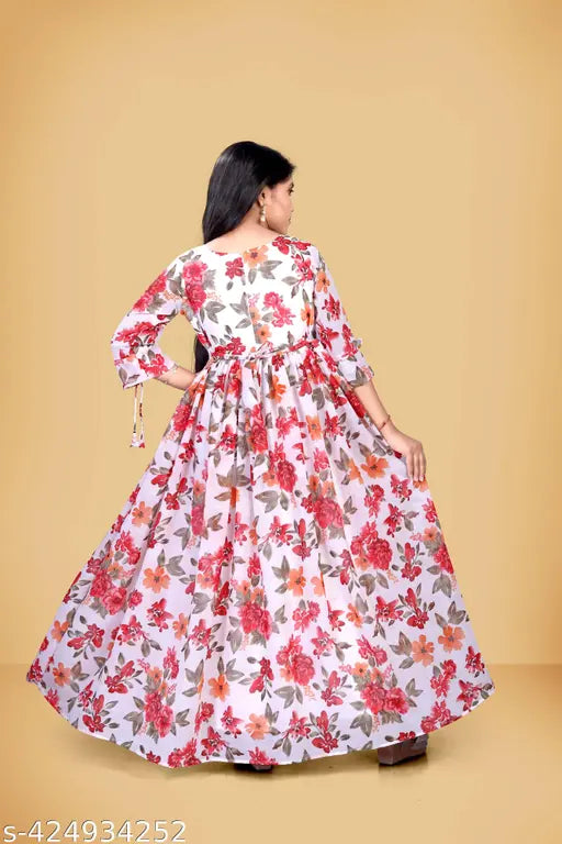 Pink rayon Georgette Anarkali gown with three-quarter sleeves, printed net pattern, trendy ethnic wear for women aged 9-10 years